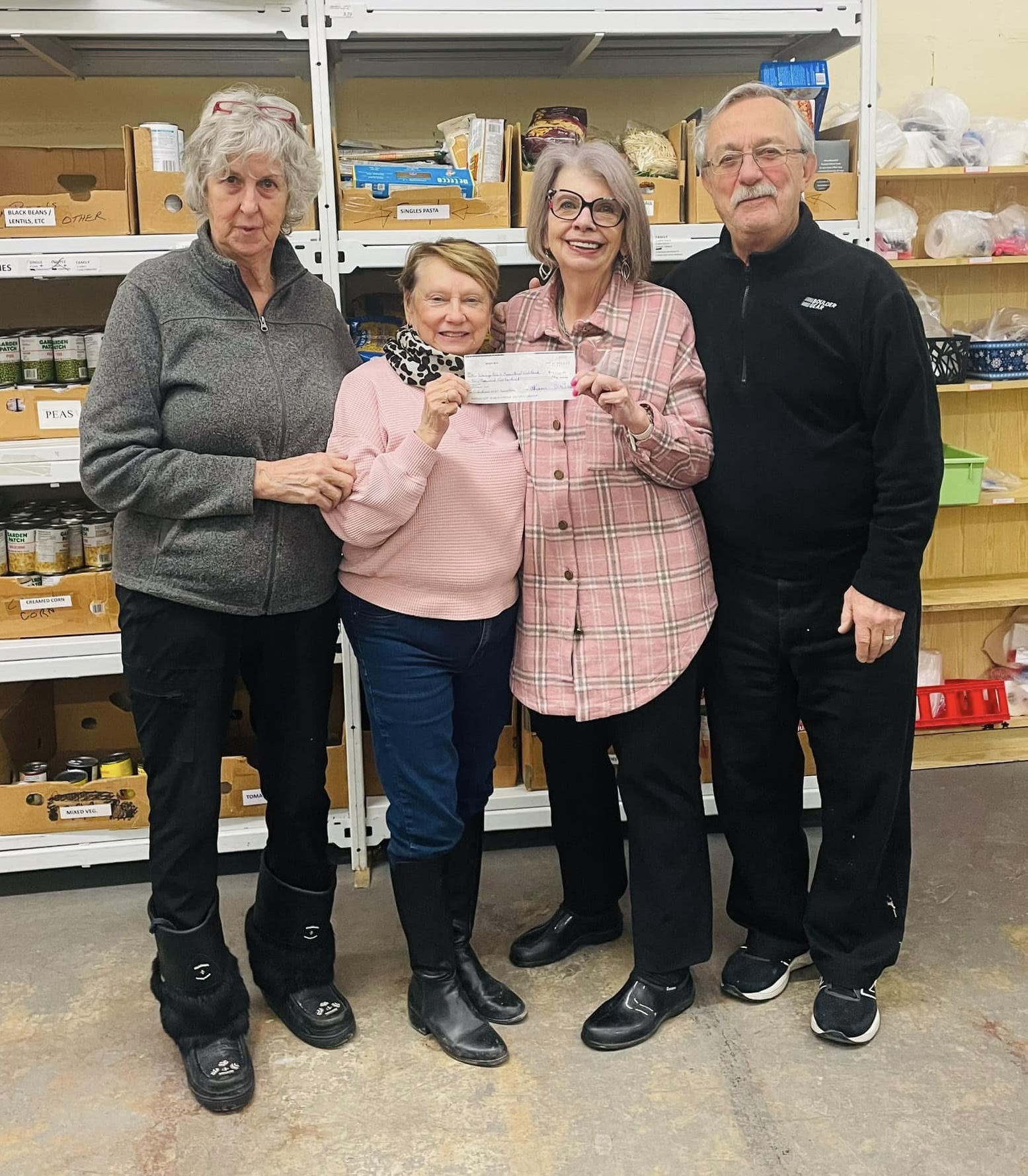 Ellen Timms presenting a Wasaga Beach Bite donation cheque to local food bank volunteers