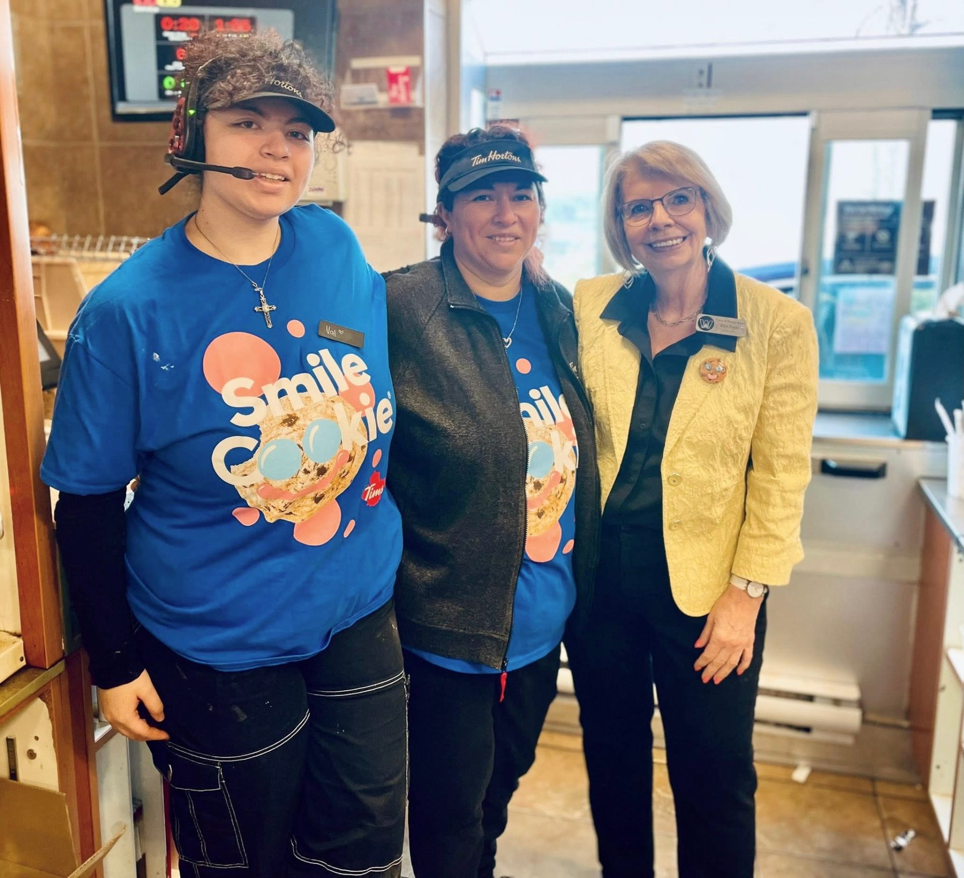 Ellen Timms with local Tim Hortons staff during the Smile Cookie campaign